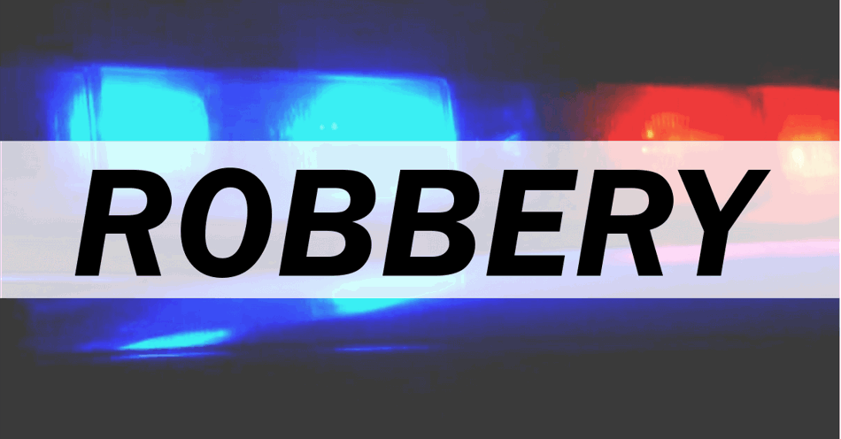 Police car light bar in the background with the word robbery overlaid in the center.